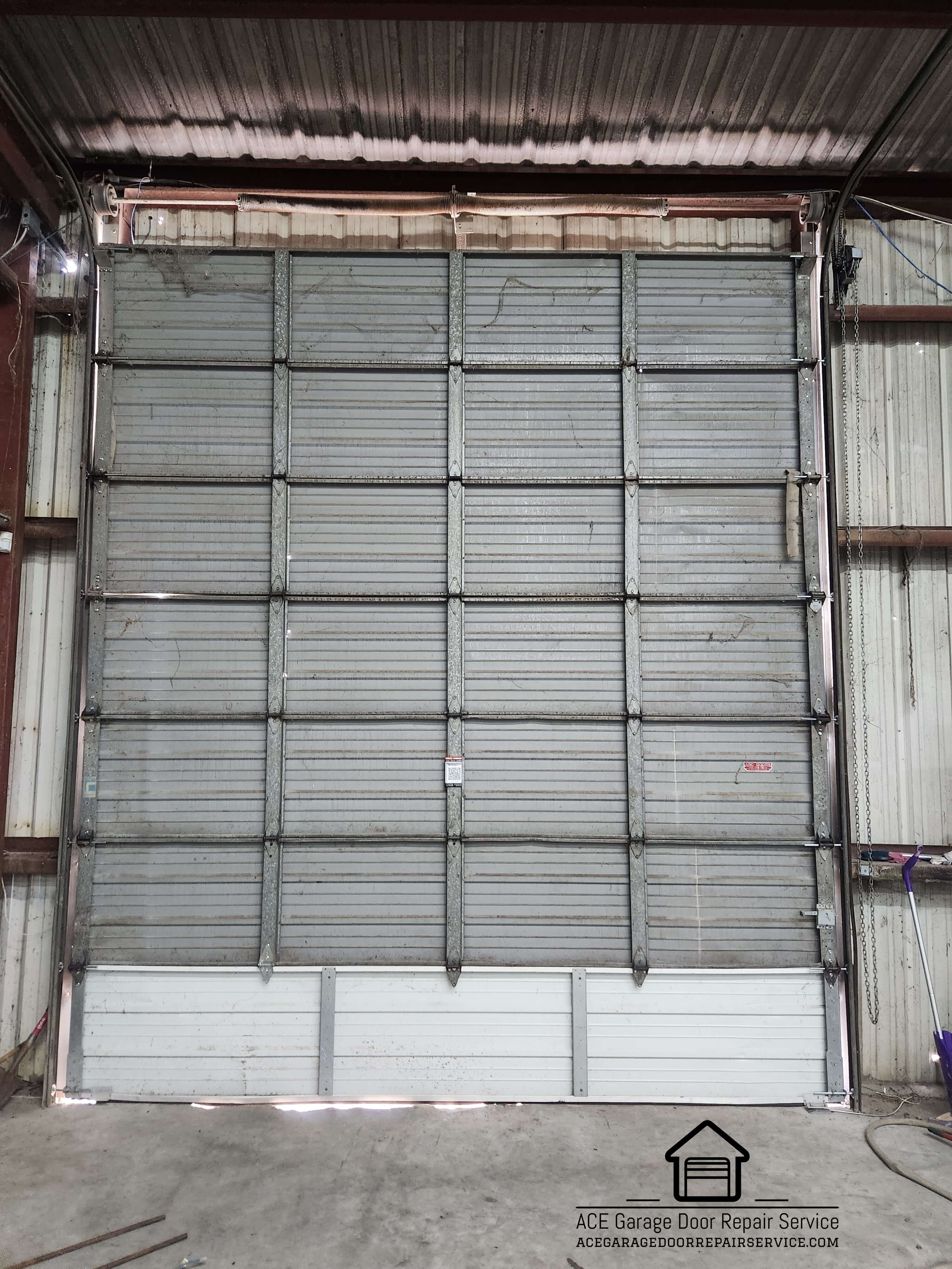 acegaragedoorrepairservice.com_commercial_garage_door_section_replacement